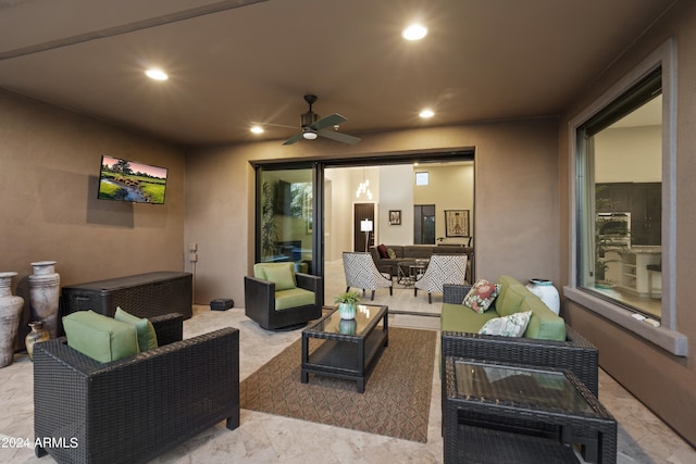 view of patio / terrace with an outdoor living space and ceiling fan