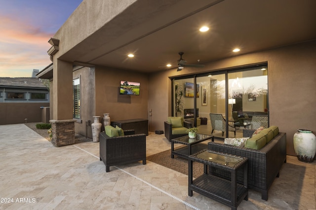 view of patio featuring an outdoor living space and ceiling fan