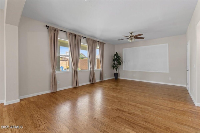 3784 E Washington Ct, Gilbert, AZ 85234 - empty room with a ceiling fan, light wood-type flooring, and baseboards