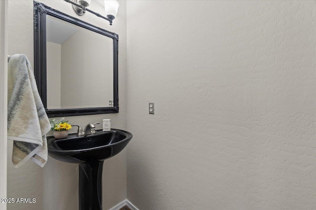 3784 E Washington Ct, Gilbert, AZ 85234 - bathroom with a textured wall and a sink