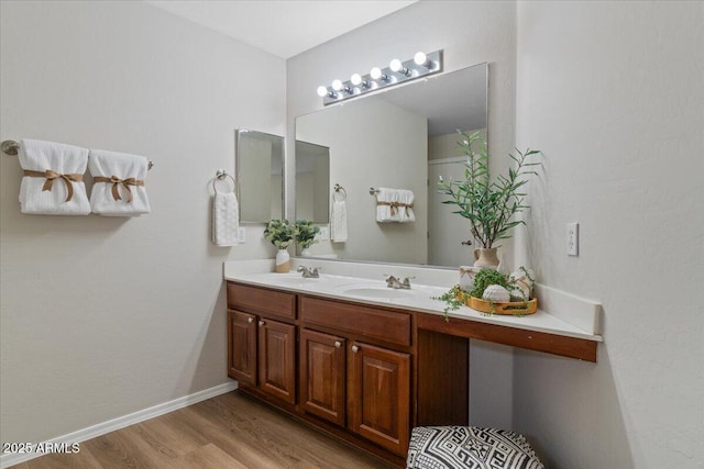 3784 E Washington Ct, Gilbert, AZ 85234 - full bath featuring wood finished floors, double vanity, and baseboards
