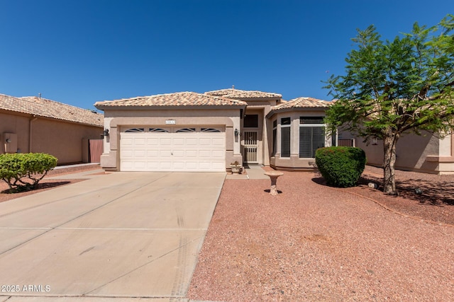20632 N 103rd Ave, Peoria, AZ 85382 - mediterranean / spanish-style home featuring stucco siding, driveway, a garage, and a tile roof