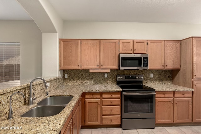 20632 N 103rd Ave, Peoria, AZ 85382 - kitchen with appliances with stainless steel finishes, light stone countertops, and decorative backsplash