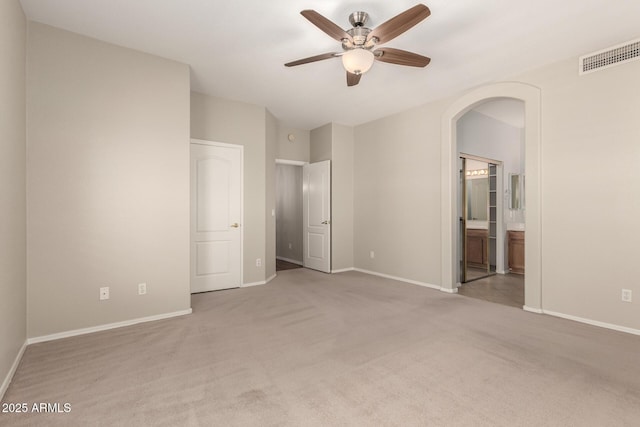 20632 N 103rd Ave, Peoria, AZ 85382 - unfurnished bedroom featuring arched walkways, carpet, and ensuite bathroom