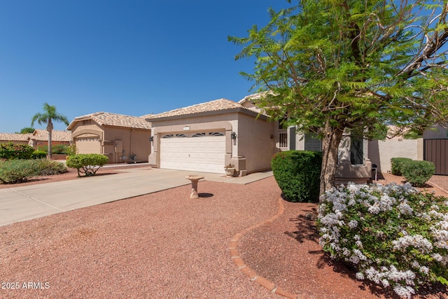 20632 N 103rd Ave, Peoria, AZ 85382 - view of front of house featuring stucco siding, an attached garage, driveway, and a tile roof
