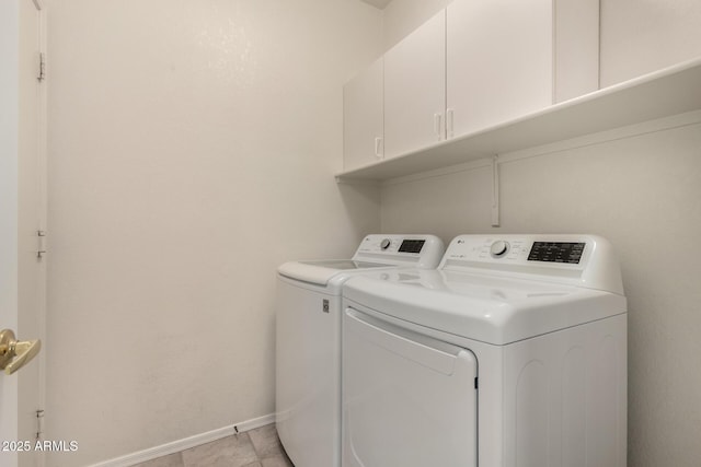 20632 N 103rd Ave, Peoria, AZ 85382 - washroom featuring cabinet space, washer and clothes dryer, and light tile patterned floors