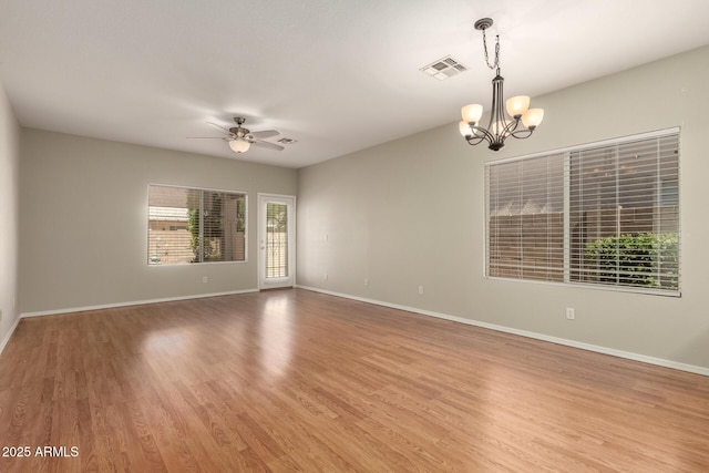 20632 N 103rd Ave, Peoria, AZ 85382 - unfurnished room with a chandelier, light wood finished floors, and a ceiling fan