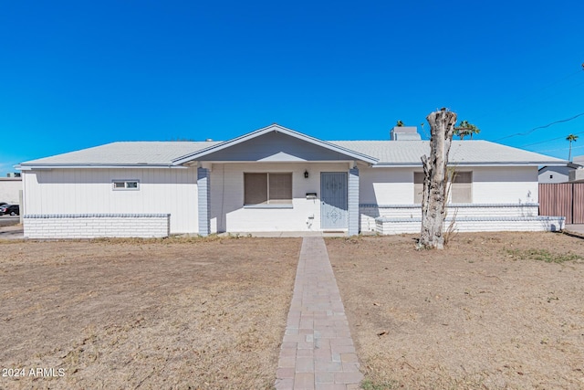 ranch-style home featuring a garage