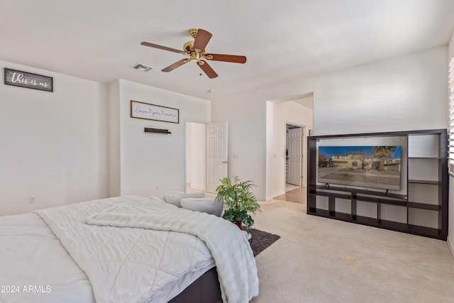 bedroom featuring light colored carpet and ceiling fan