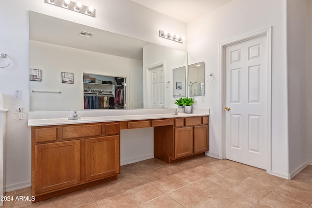 bathroom featuring tile patterned flooring and vanity