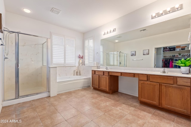 bathroom featuring tile patterned flooring, vanity, and separate shower and tub