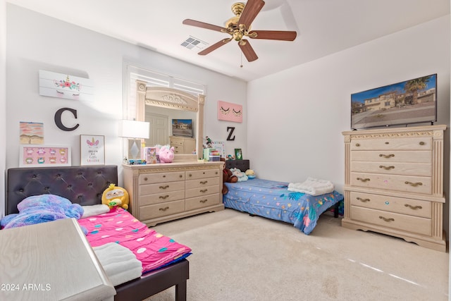 bedroom with ceiling fan and light colored carpet