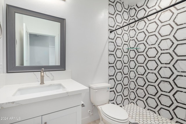 10785 W Arivaca Dr, Arizona City, AZ 85123 - bathroom with vanity, walk in shower, and toilet