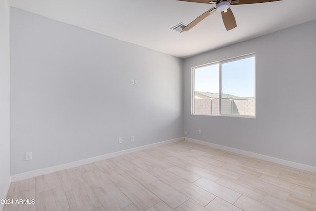 10785 W Arivaca Dr, Arizona City, AZ 85123 - empty room with baseboards, a ceiling fan, and visible vents