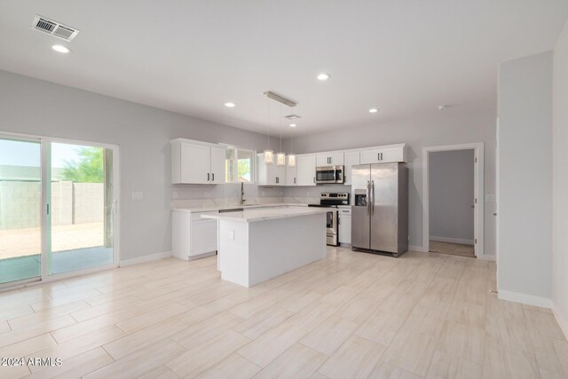 10785 W Arivaca Dr, Arizona City, AZ 85123 - kitchen featuring white cabinetry, visible vents, a sink, light countertops, and stainless steel appliances