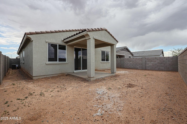 2586 E Music Mountain Ave, Apache Junction, AZ 85119 - rear view of property featuring a fenced backyard, a patio, stucco siding, a tile roof, and central air condition unit