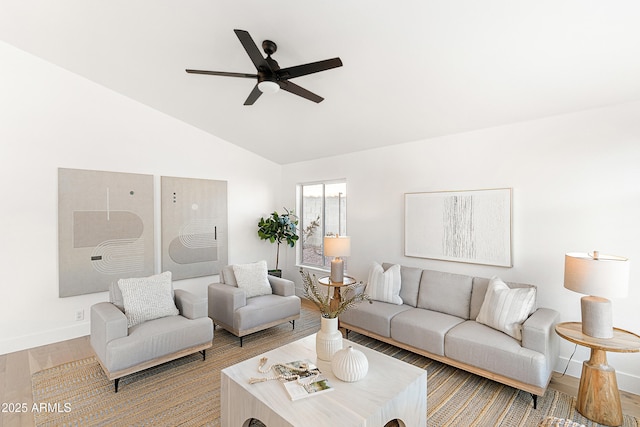 living room featuring vaulted ceiling, hardwood / wood-style floors, and ceiling fan