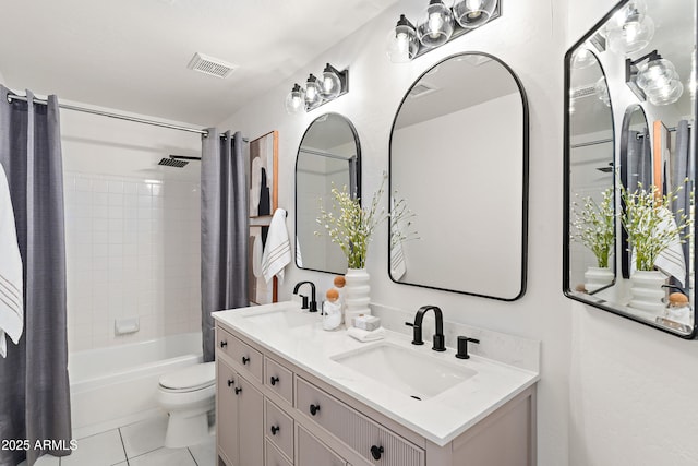 full bathroom with vanity, shower / bath combination with curtain, tile patterned floors, and toilet