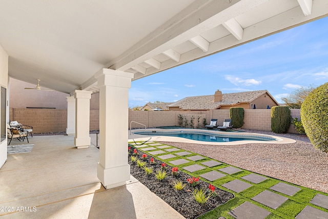 view of pool featuring ceiling fan and a patio area