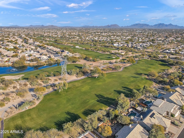 drone / aerial view with a water and mountain view