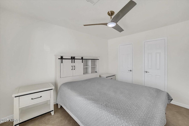 bedroom with light tile patterned floors and ceiling fan