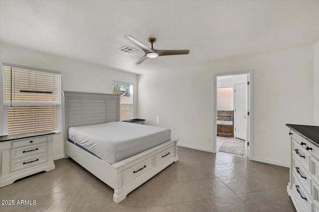 bedroom featuring ensuite bathroom, ceiling fan, and light tile patterned flooring