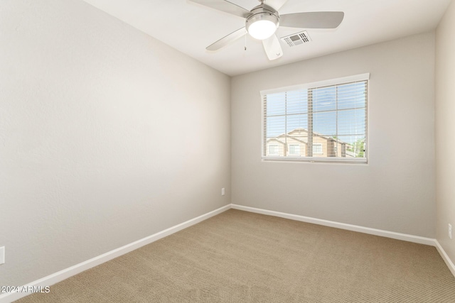 1021 W Vineyard Plains Dr, San Tan Valley, AZ 85143 - spare room featuring light carpet, visible vents, a ceiling fan, and baseboards