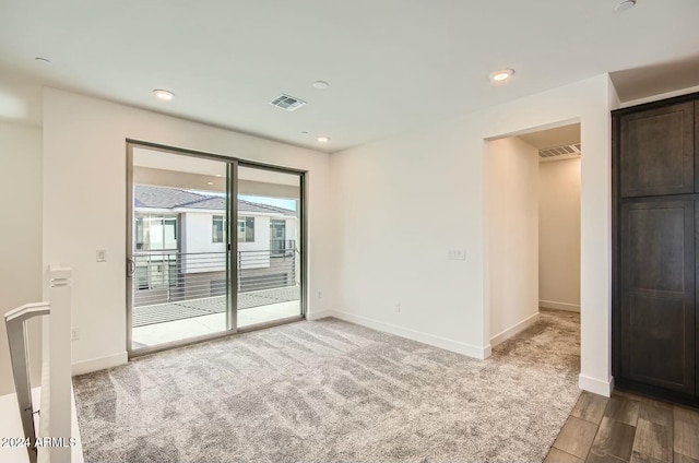 unfurnished room featuring carpet floors