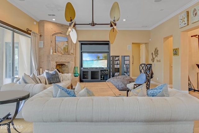 living room featuring ornamental molding and a fireplace