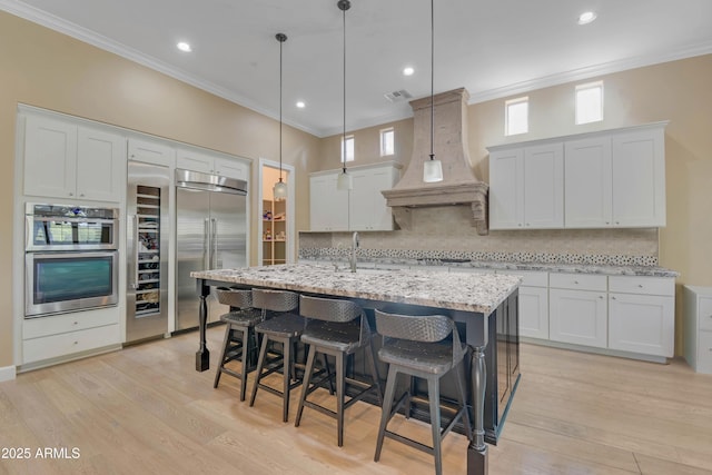 kitchen with appliances with stainless steel finishes and white cabinetry