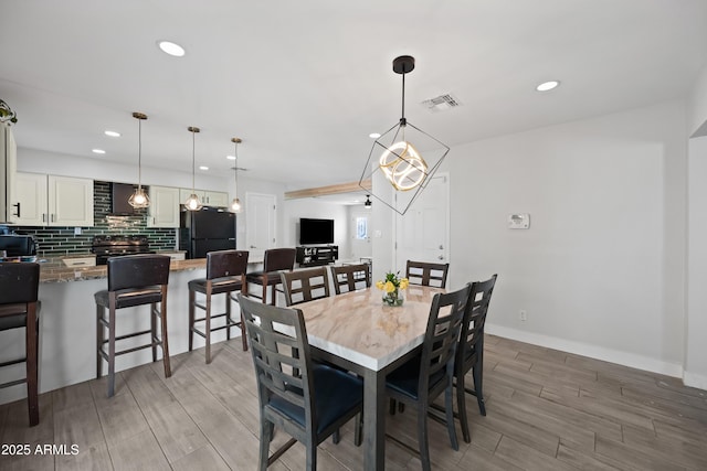 dining space featuring a chandelier