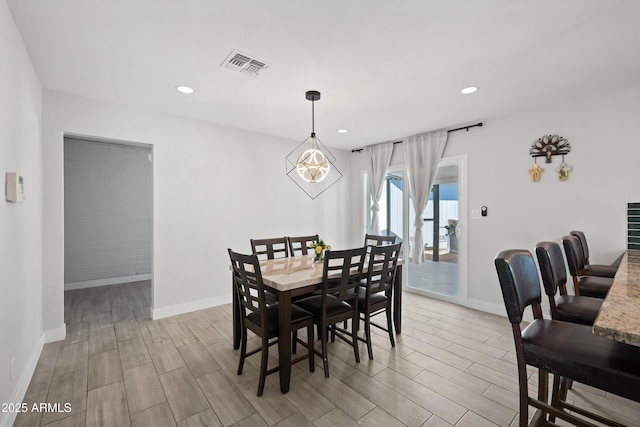 dining space with a chandelier