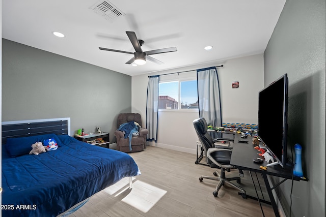 bedroom featuring ceiling fan and light hardwood / wood-style floors