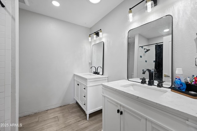 bathroom with vanity and walk in shower