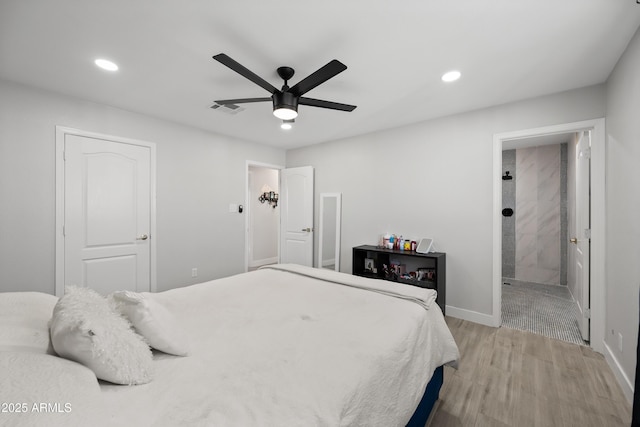 bedroom featuring ceiling fan, connected bathroom, and light hardwood / wood-style floors