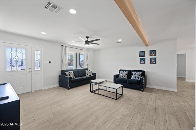 living room with beam ceiling and ceiling fan