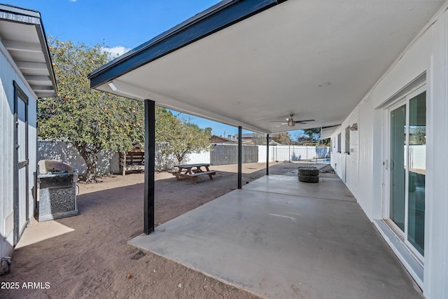 view of patio with area for grilling and ceiling fan