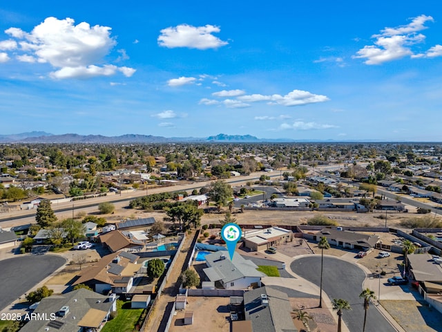 birds eye view of property with a mountain view