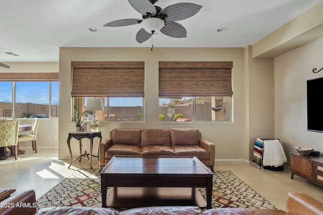 tiled living room featuring ceiling fan