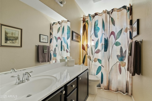 bathroom featuring tile patterned flooring, vanity, curtained shower, and toilet