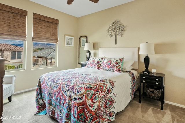 bedroom with light carpet and ceiling fan