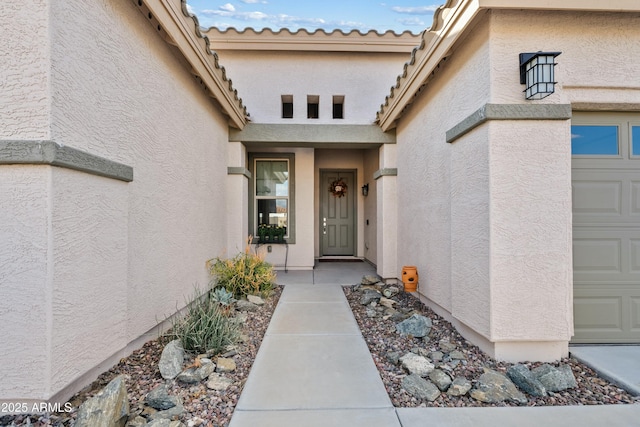 doorway to property featuring a garage