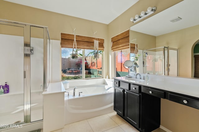 bathroom with tile patterned flooring, vanity, and independent shower and bath