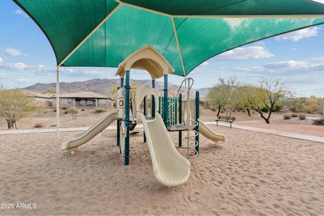 view of playground featuring a mountain view