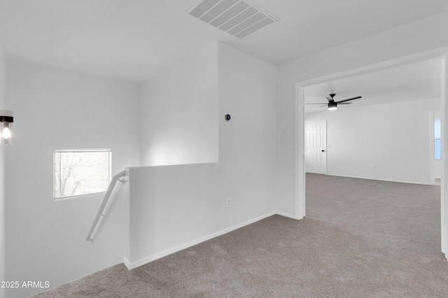 carpeted empty room with ceiling fan