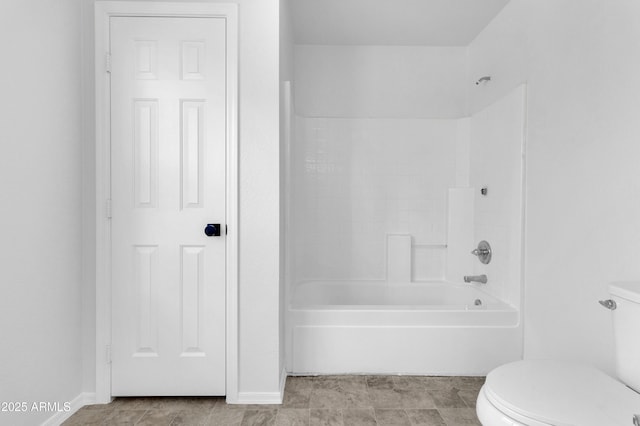 bathroom with toilet and shower / tub combination