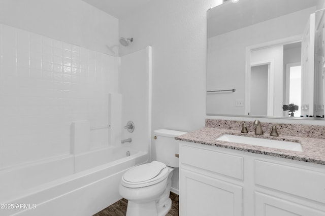 full bathroom with hardwood / wood-style floors, vanity, toilet, and tub / shower combination