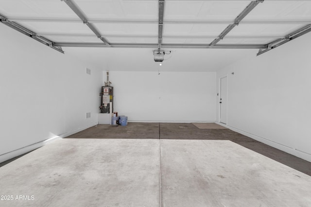 garage with gas water heater and a garage door opener