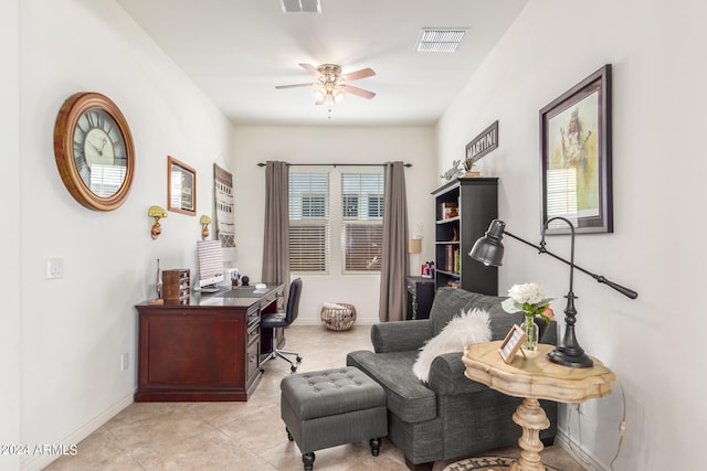 tiled home office featuring ceiling fan