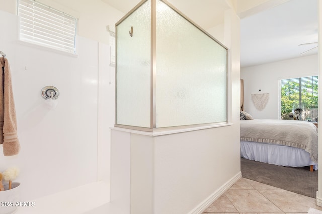 bathroom featuring tile patterned flooring and an enclosed shower